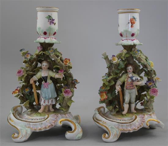 A pair of Meissen arbour chambersticks, early 20th century, 13.5cm, both with losses